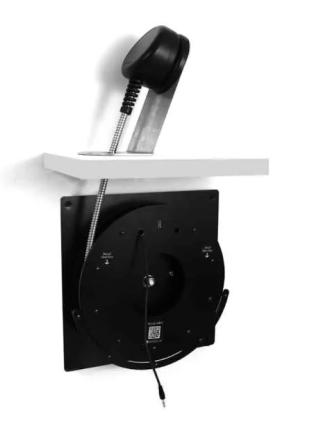 Angled desktop mount return mechanism for one-hand earphones Angled desktop mount return mechanism for one-hand earphones